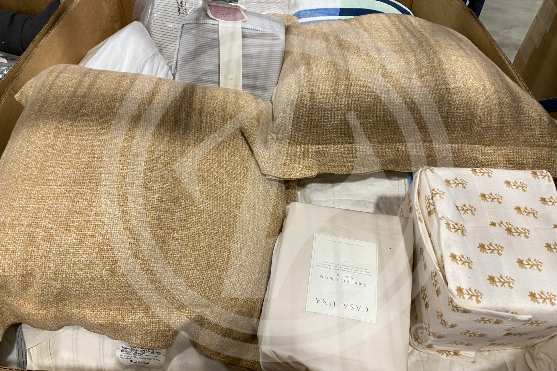 Purchase TGT Domestics truckloads featuring a mix of pillows, bed sheets, and bed comforters from Zapps Wholesale.