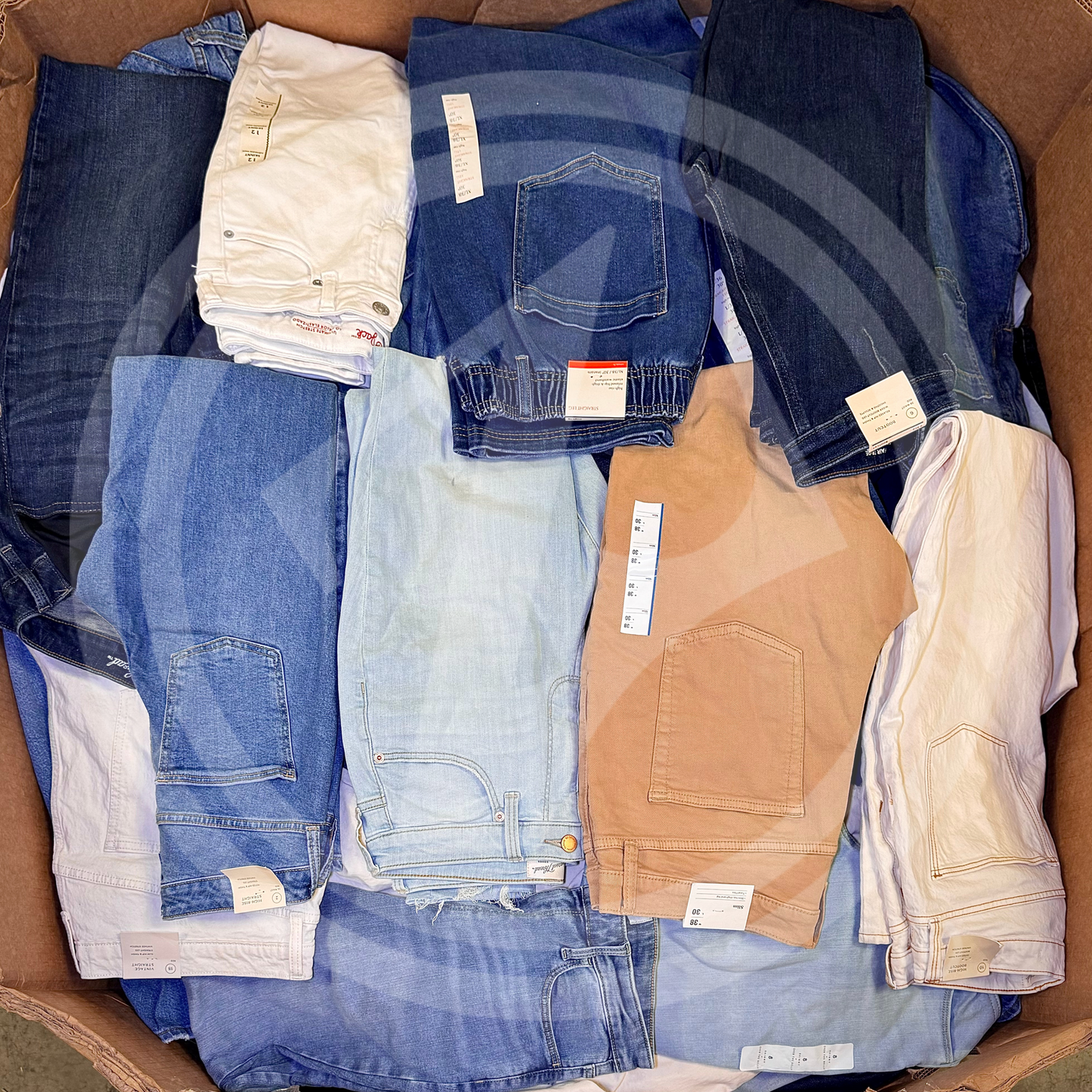 Purchase TGT jeans truckloads featuring a mix of men's, women's, and kids' jeans from Zapps Wholesale.
